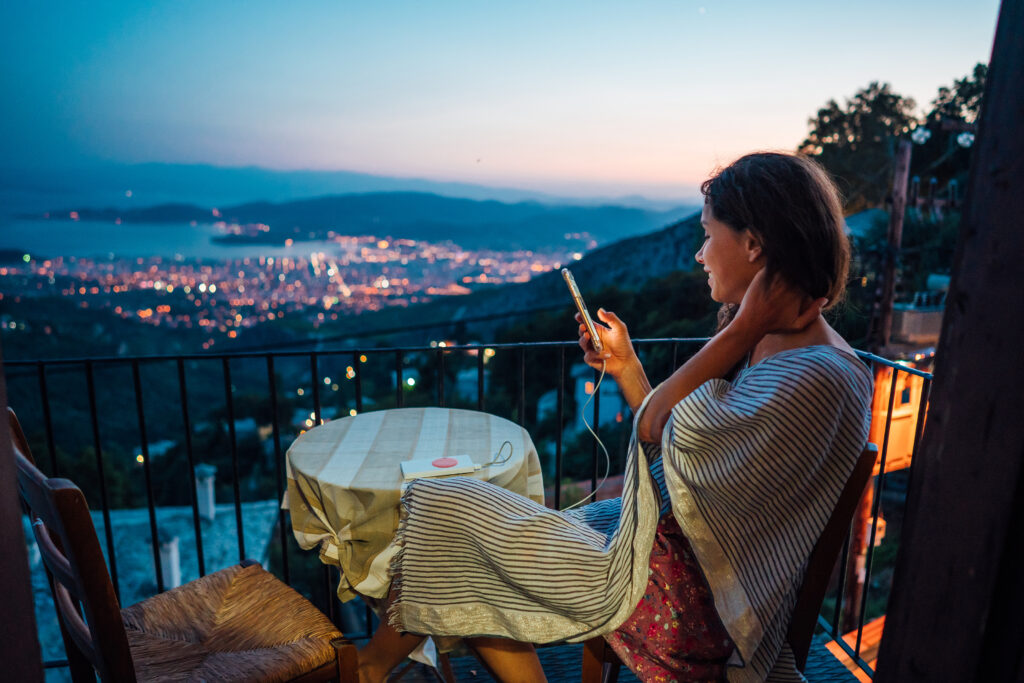 woman sits balcony background night city 2